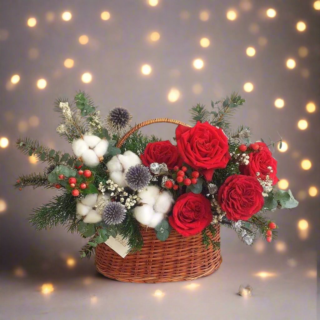 Christmas Eve flower basket with red roses, seasonal greenery, pinecones, and gold accents, perfect for holiday decor or as a festive gift