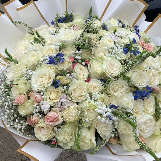 Bouquet of flowers with white and pastel colors on a white paper background