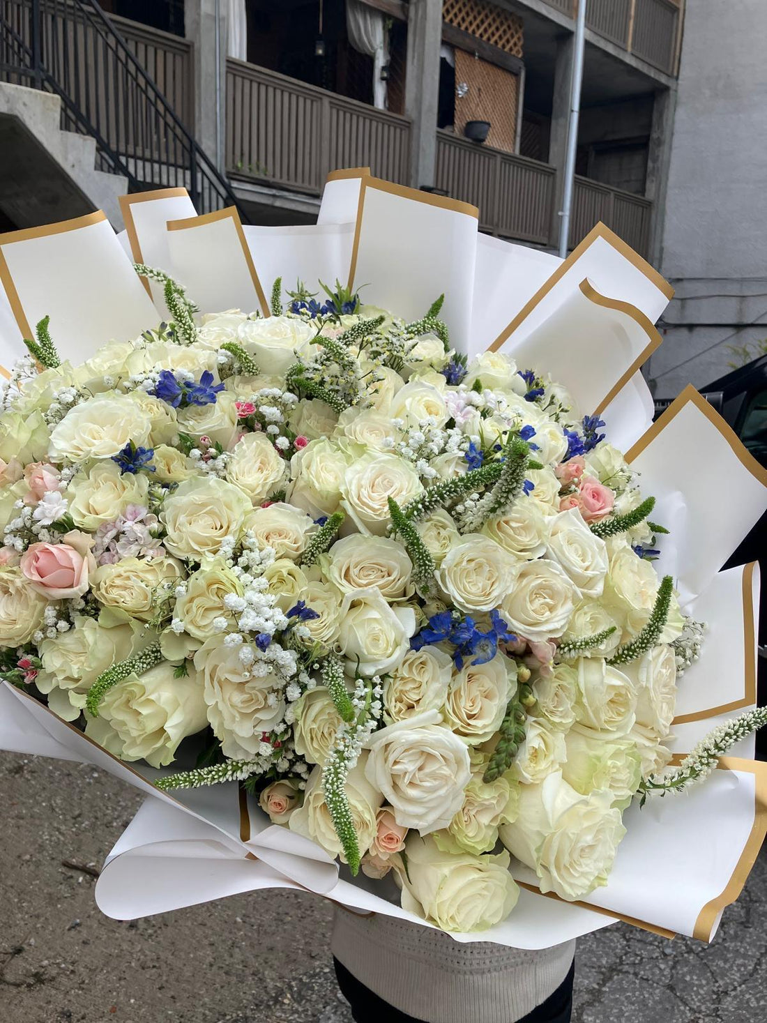 Bouquet of flowers with white and pastel colors on a white paper background