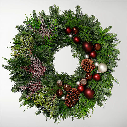 0-inch Christmas wreath featuring green foliage, pinecones, and red berries, perfect for holiday decor on doors, windows, or as a centerpiece