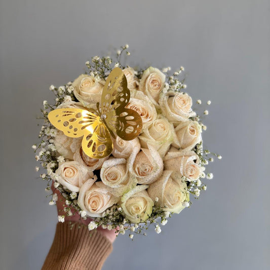 A beautifully arranged flower box filled with a mix of vibrant blooms, including roses, lilies, and daisies, complemented by lush greenery. The elegant presentation of the flowers in a stylish box makes it a perfect gift for any occasion, adding a touch of beauty and charm to any space.