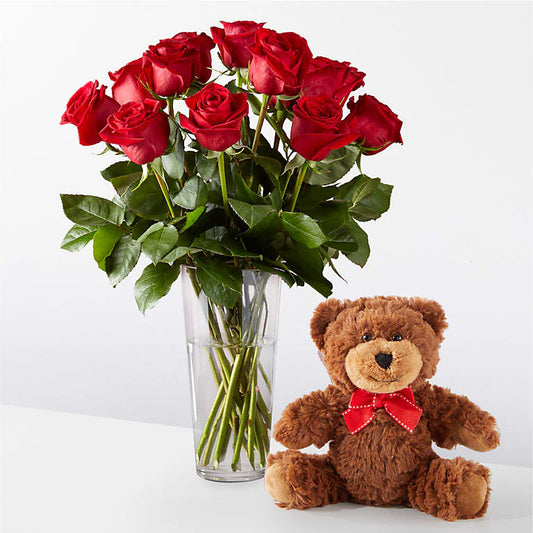 Beautiful bouquet of red roses in a vase, accompanied by a soft teddy bear, available in 1 dozen, 2 dozen, and 3 dozen sizes, perfect for romantic occasions.